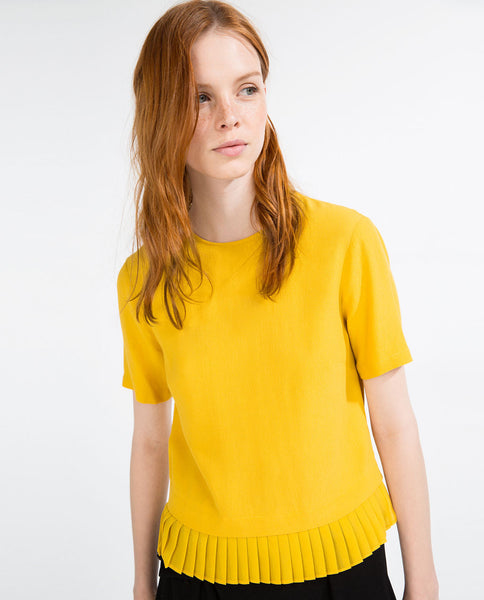 TOP WITH PLEATED HEM